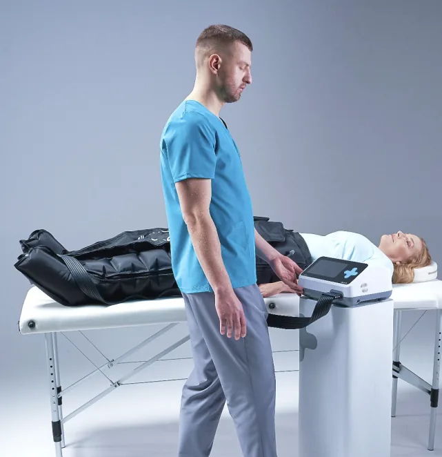 Therapist standing beside a patient using the CarePump system